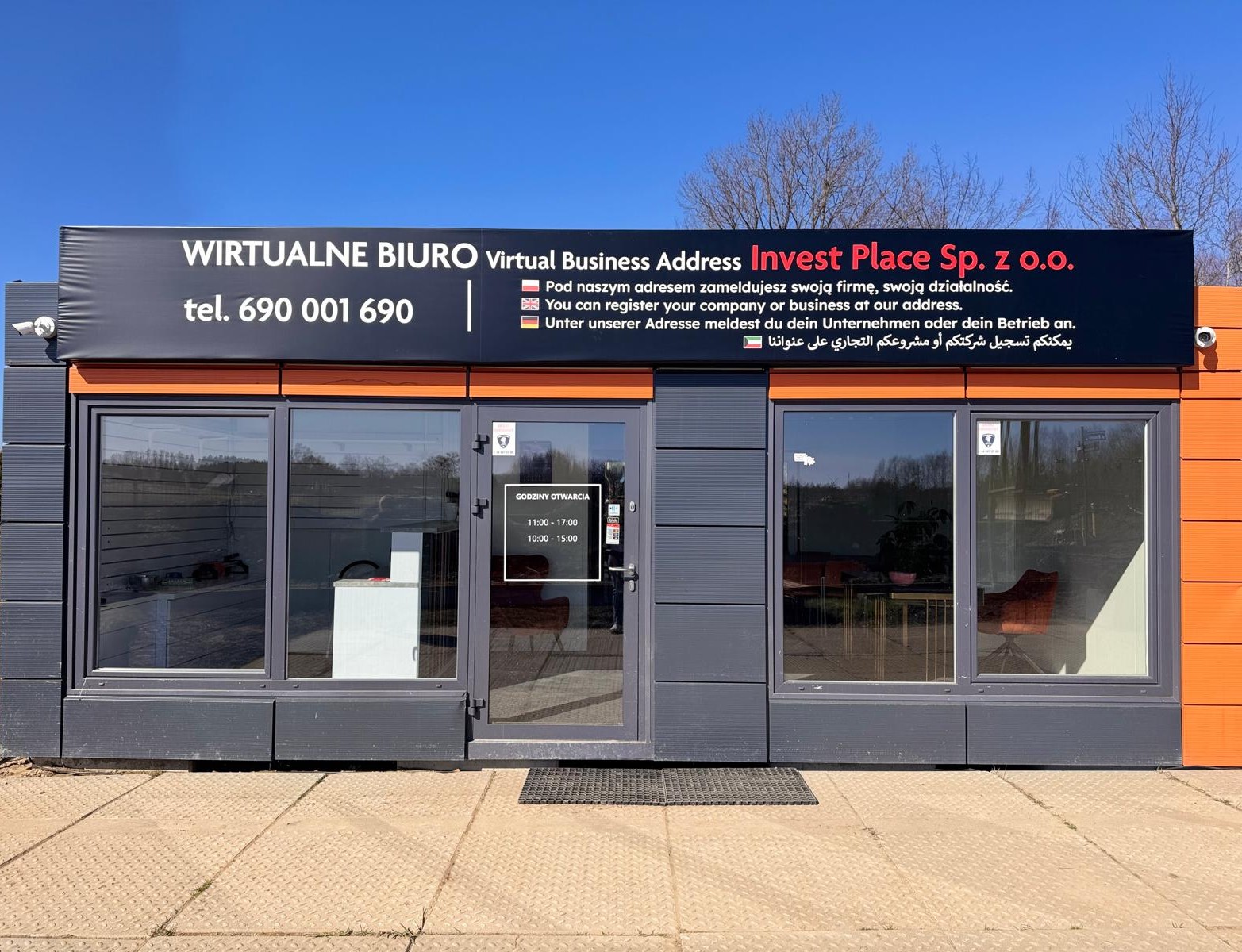 Invest Place office in Pomlewo - modern building with orange accents